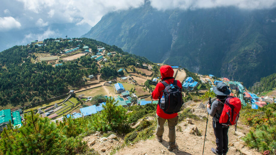 nepal-hiahg-trekker-looking-below-to-view-of-namche-bazaar-village-in-khumbu-shutterstock_1627571863.jpg
