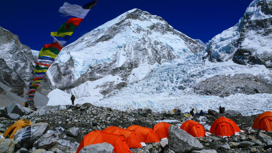nepal-hikev-bright-color-tents-on-the-khumbu-glacier-in-area-of-everest-base-camp-with-colorful-prayer-flags-and-himalaya-mountain-range-shutterstock_765291118.jpg