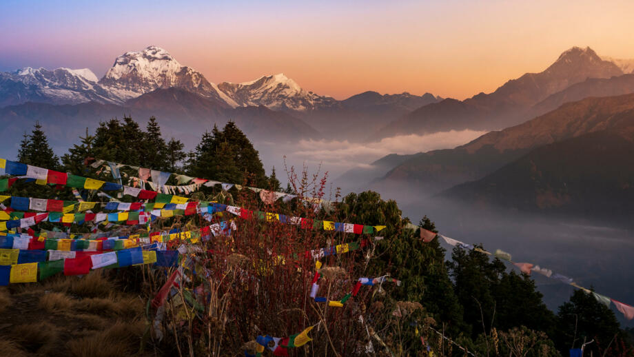 nepal-hilhb-view-of-mount-dhaulagiri-with-prayer-flags-shutterstock_1509729932.jpg