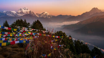 nepal-hilhb-view-of-mount-dhaulagiri-with-prayer-flags-shutterstock_1509729932.jpg