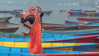 nepal-hilhb-women-in-sari-standing-on-the-boat-phewa-lake-pokhara-shutterstock_613078763.jpg