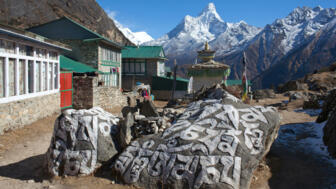 nepal-higpeve-ancient-buddhists-chorten-mani-stones-in-khumjung-village-and-ama-dablam-mount-view-shutterstock_1071826601.jpg