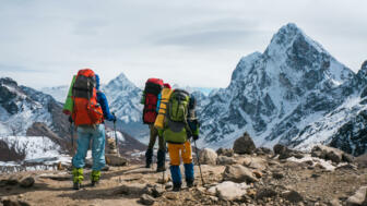 nepal-hikpa-travellers-in-the-himalayas-with-view-ama-dablam-shutterstock_754698244.jpg