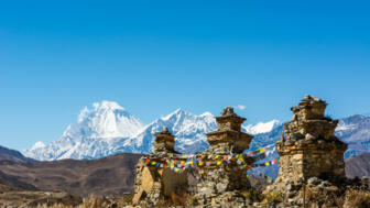 nepal-hiaha-buddhist-chorten-above-muktinath-village-dhaulagiri-rising-in-the-babkground-shutterstock_504320341.jpg